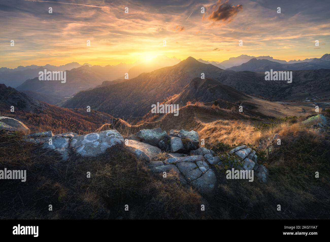Stones and mountains at colorful sunset in autumn Stock Photo