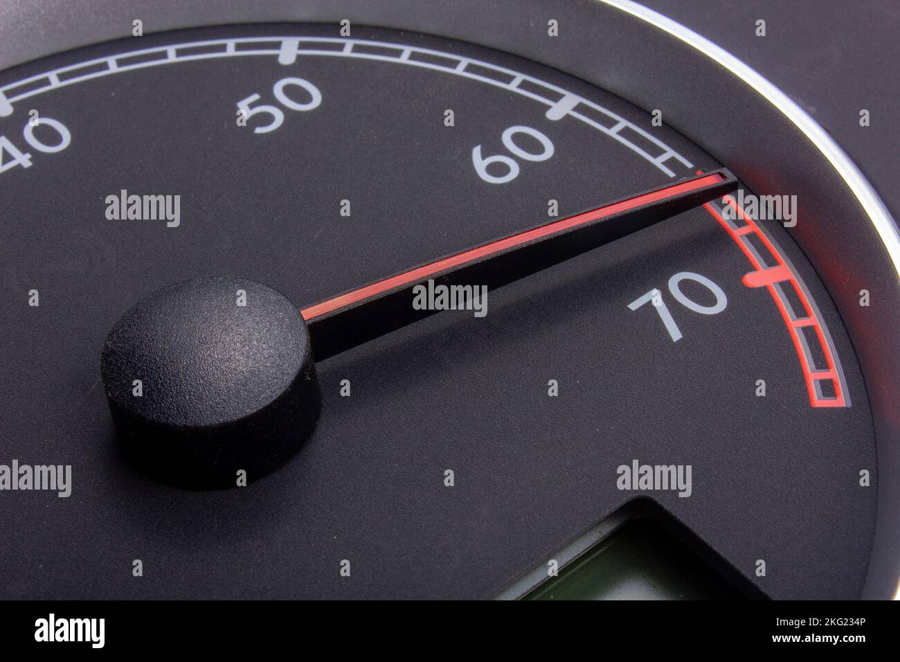 Car gauges tachometer black dial, red needle, chrome Stock Photo