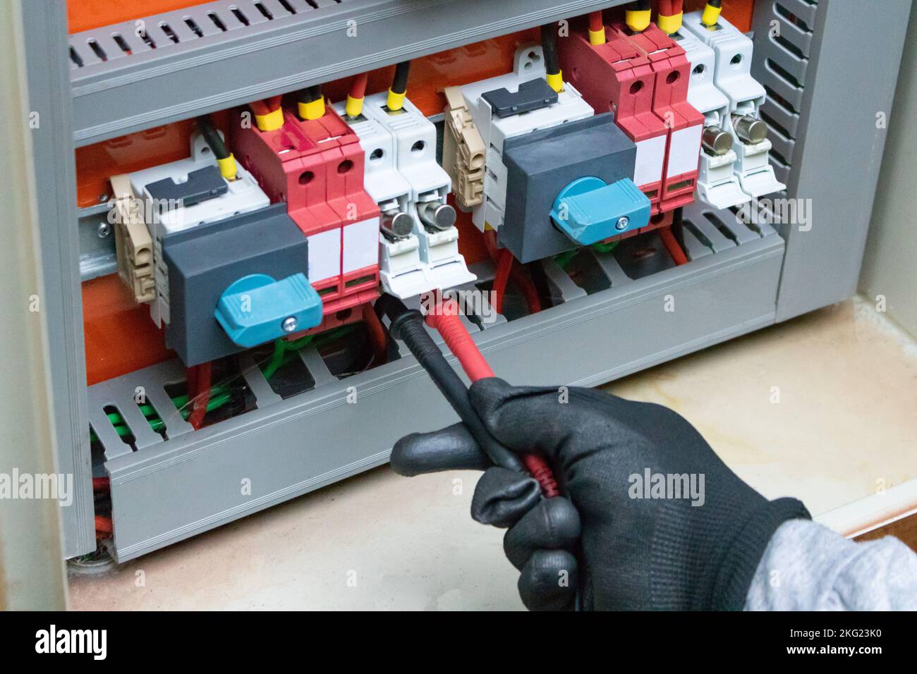 Cleaning and Maintenance of Solar Energy Inverter Equipment. Electrician Worker Cleaning