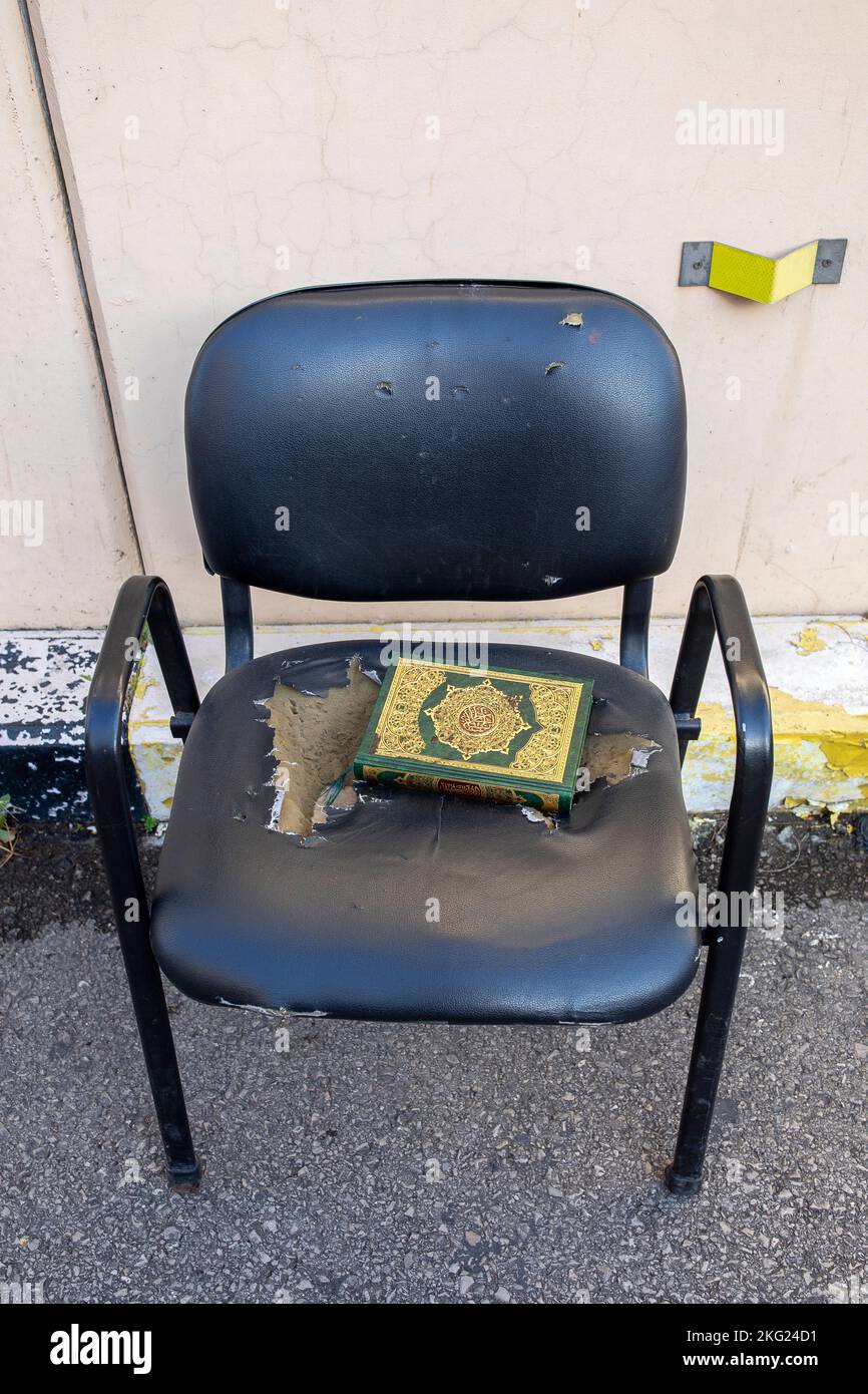 Kuran on a chair in a street in central Beirut, Lebanon Stock Photo