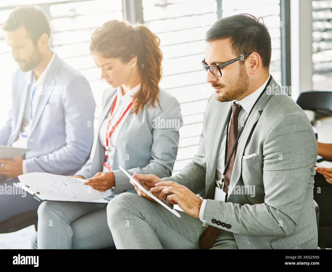 business meeting conference presentation businessman office seminar corporate team businesswoman tablet Stock Photo