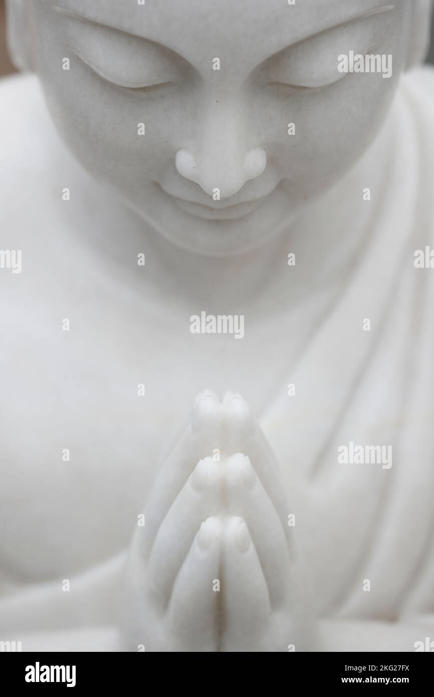 Buddhist monk praying. Marble sculpture.  Danang. Vietnam. Stock Photo