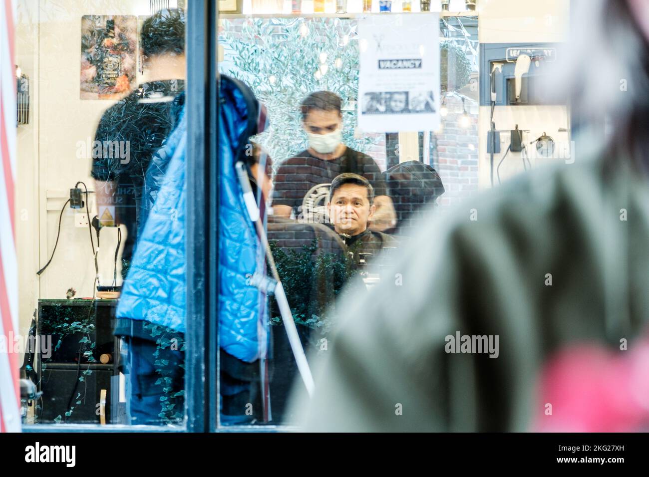 Epsom, Surrey, London UK, November 19 2022, Candid Image Of A Man Sitting In A Barbers Shop