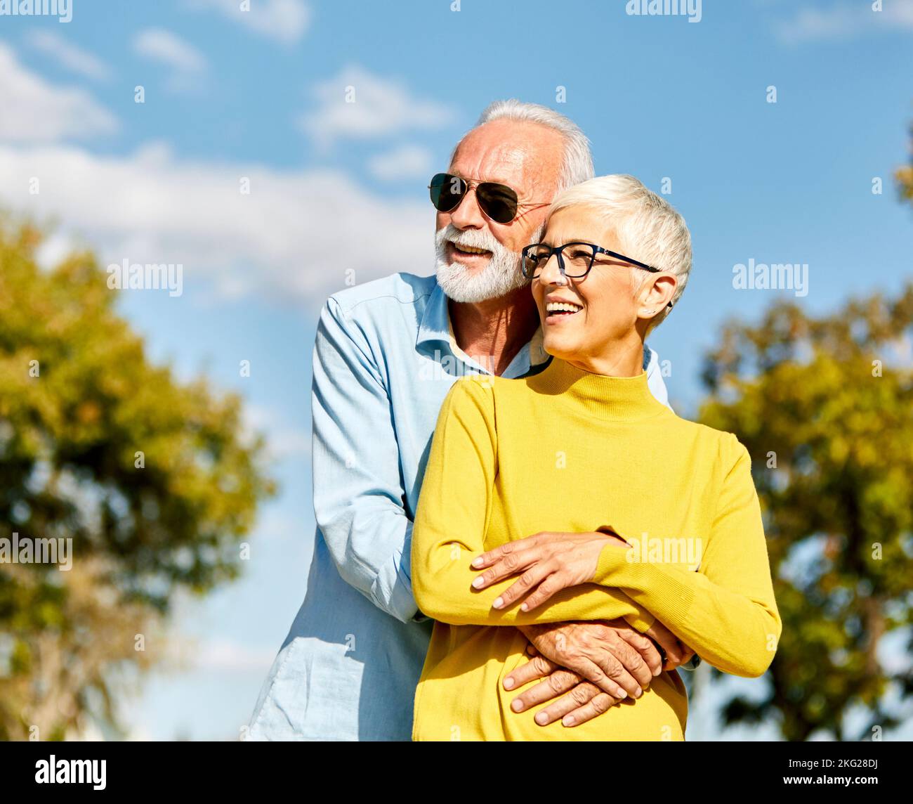 woman man outdoor senior couple happy lifestyle retirement together smiling love hug nature mature Stock Photo