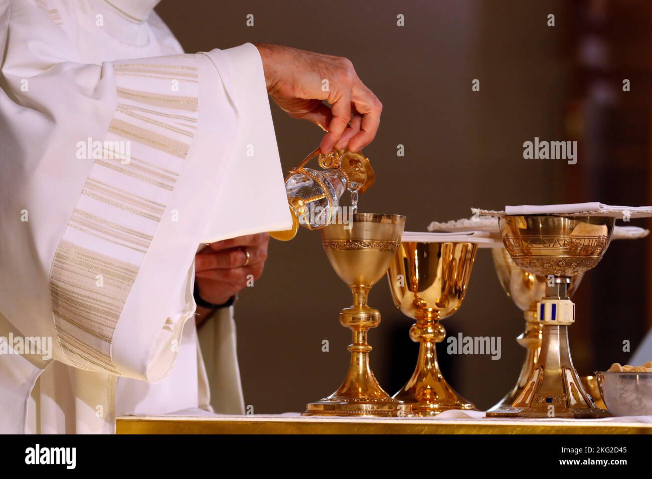 Catholic mass. Eucharist table with the liturgical items. Cruet with