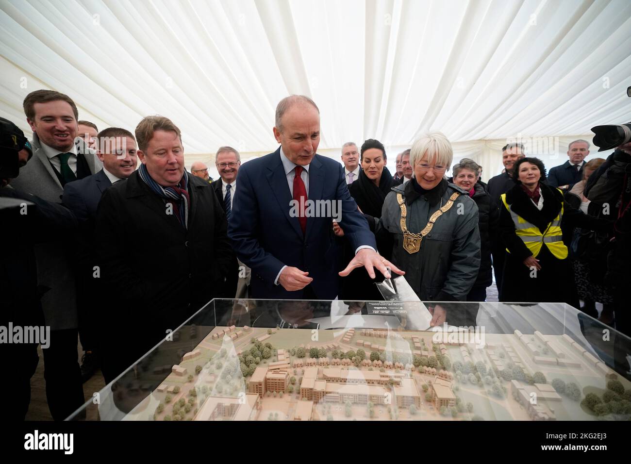Taoiseach Micheal Martin (centre) and Minister for Housing Darragh O'Brien (left) at the sod turning to mark the start of construction of 597 affordable homes at the Shankhill development at Shanganagh, Co Dublin. Picture date: Monday November 21, 2022. Stock Photo
