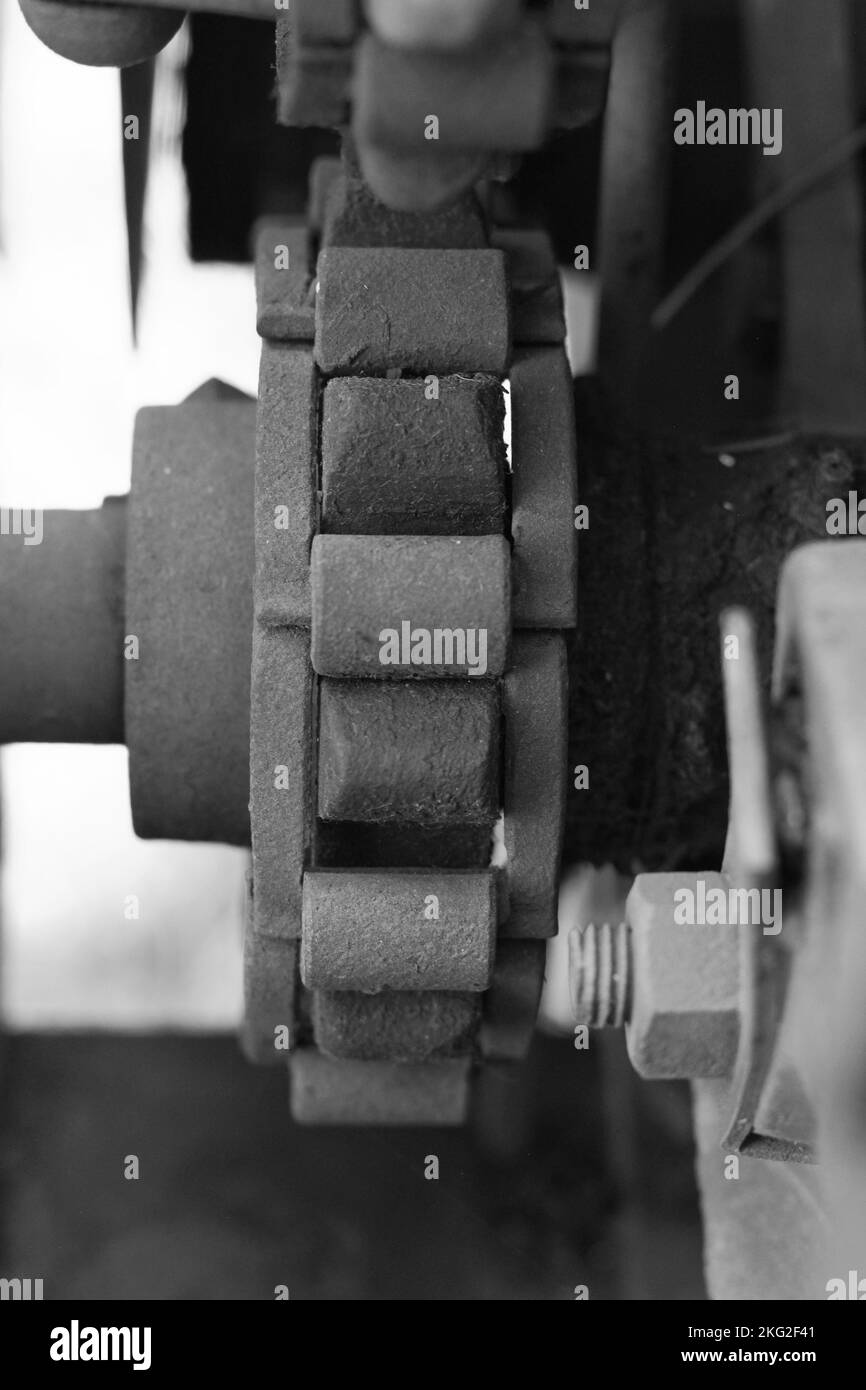 Vintage mechanical machine and engine with chains and gears in a black