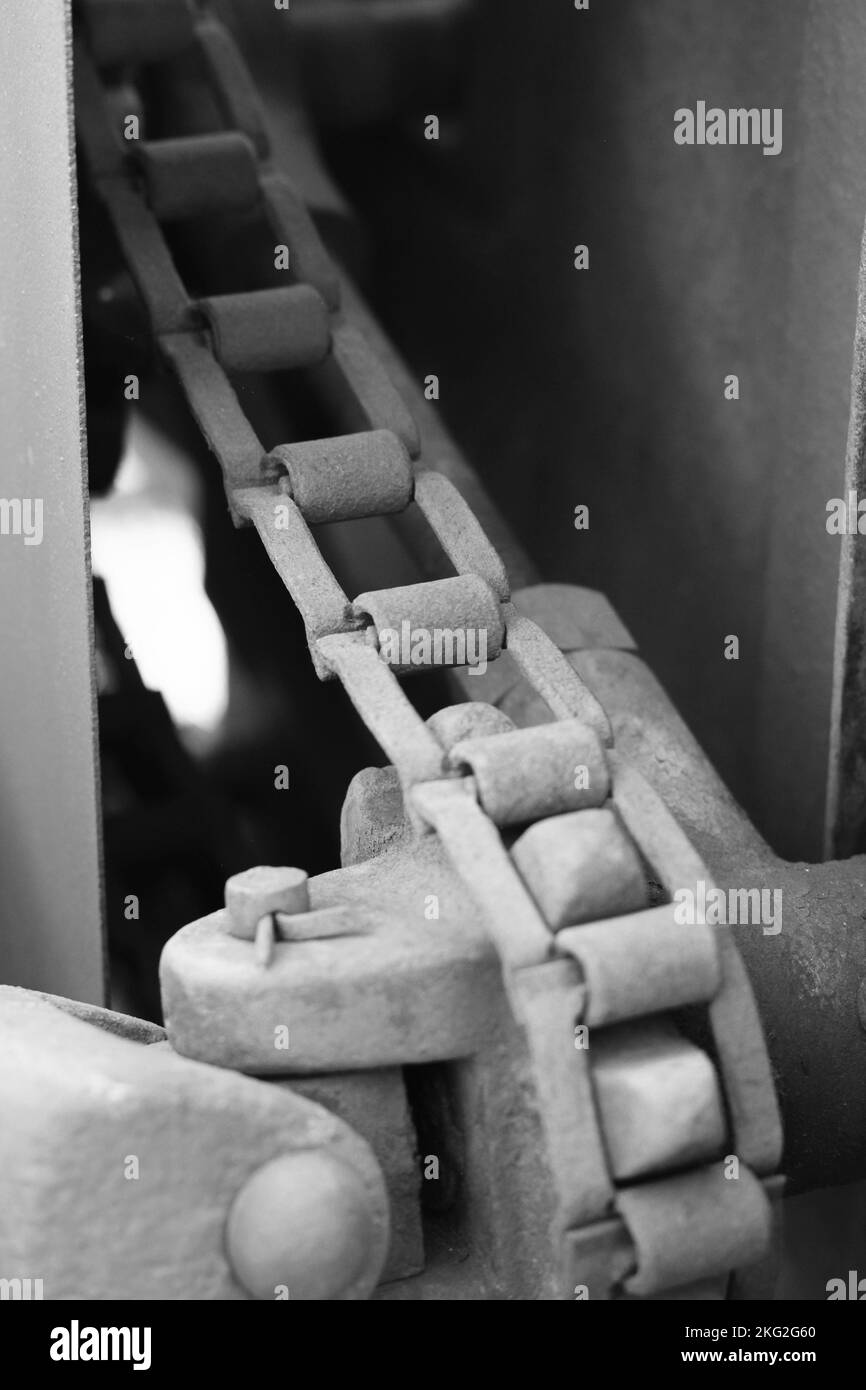 Vintage mechanical machine and engine with chains and gears in a black
