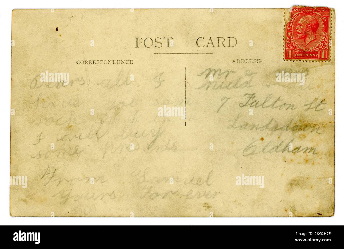 Original shabby, grubby, reverse of 1920's postcard, with child's handwriting in pencil. This card has a postmarked 1d (one penny) Red King George V (postally used) stamp.(Postage rate for postcards was increased to one penny on 3rd June 1918). U.K. Stock Photo