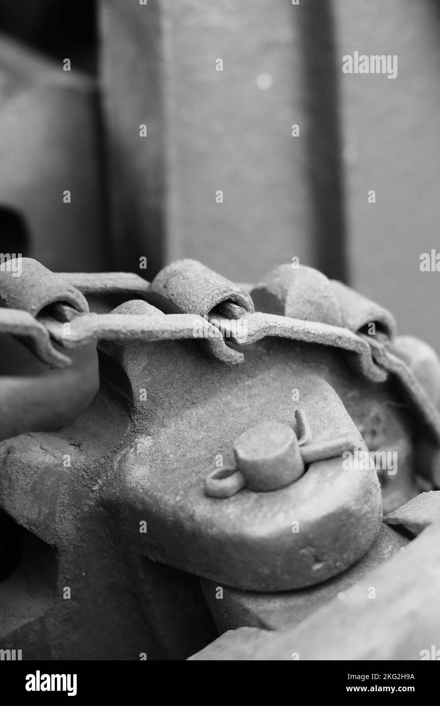 Vintage mechanical machine and engine with chains and gears in a black