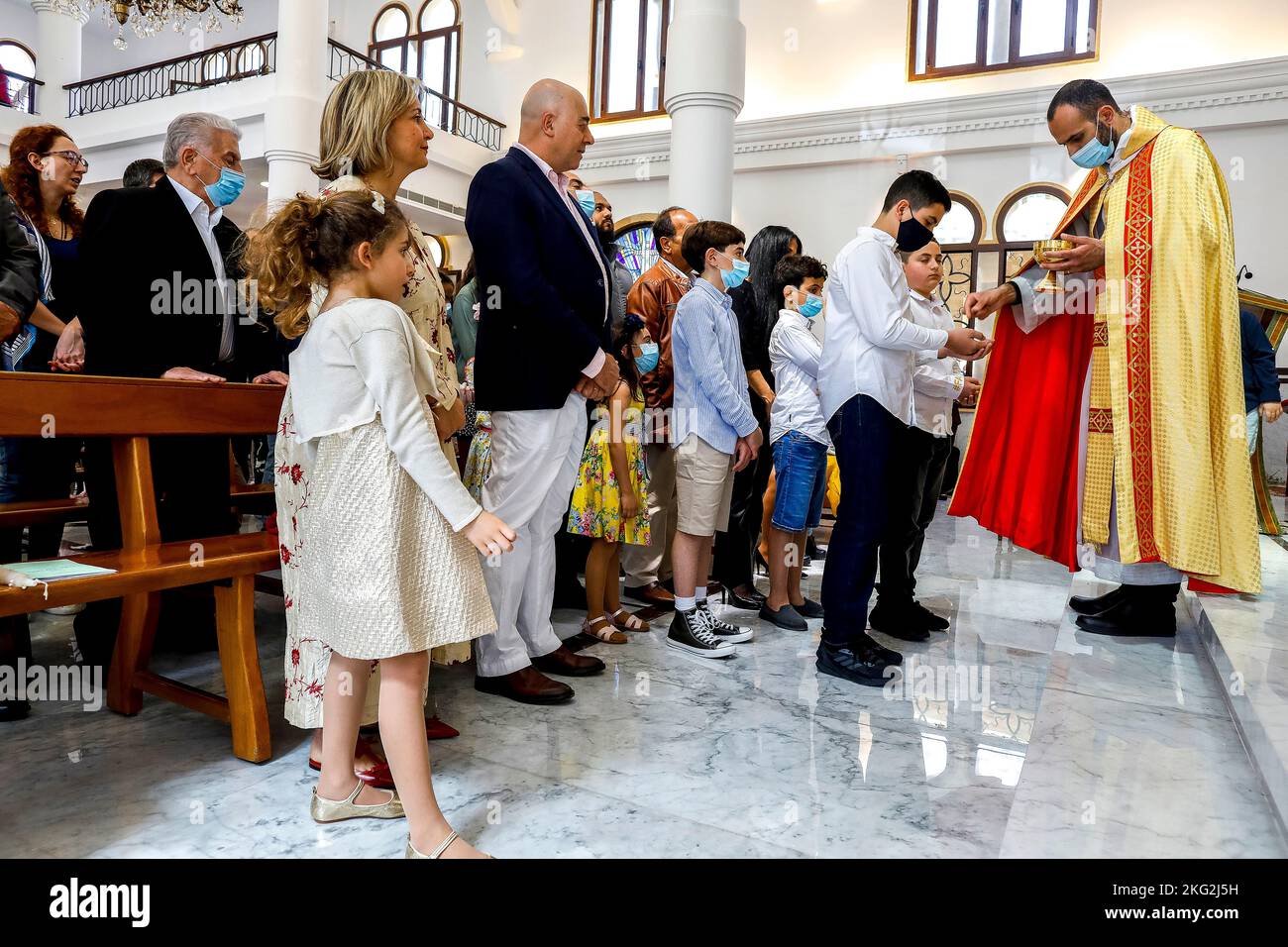Palm sunday celebration in Our Lady maronite church, Houmal, Lebanon. Holy communion Stock Photo