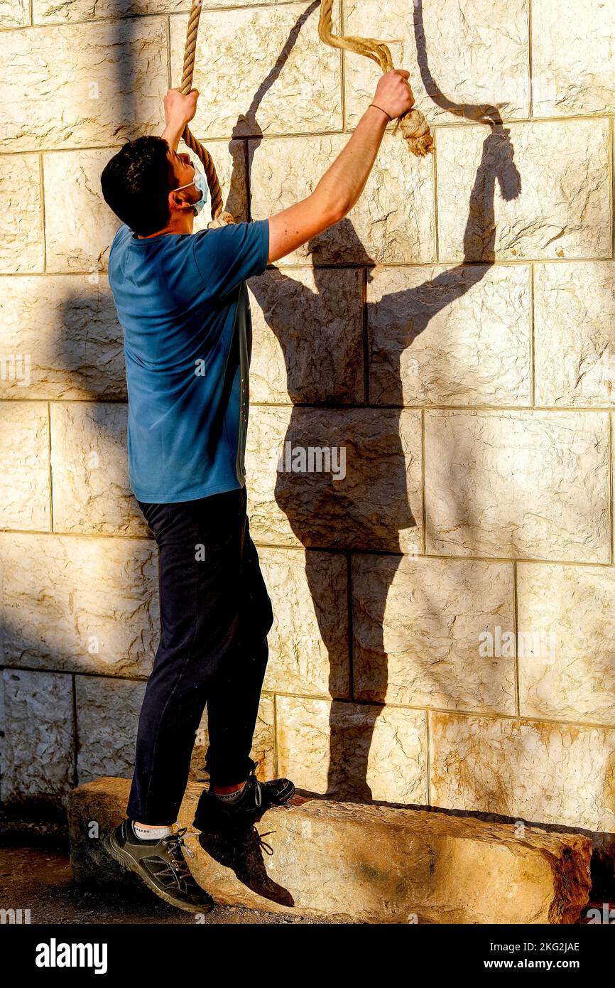 Young man ringing bell hi-res stock photography and images - Alamy
