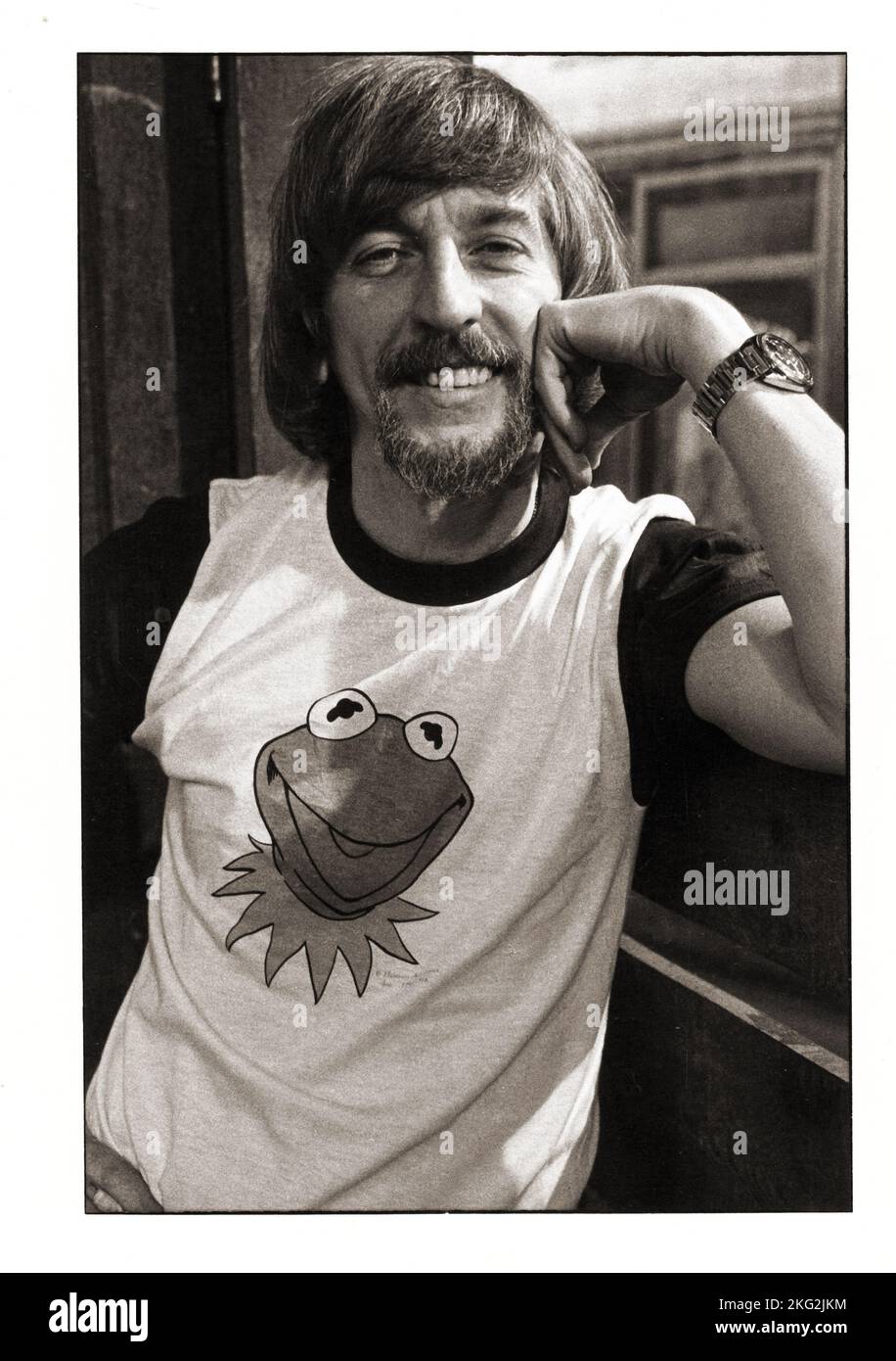 A casual portrait of he late actor puppeteer Carrol Spinney at home & in his Kermit the Frog t shirt. On Sesame Street, Spinney played inside of Big Bird and operated the Oscar the Grouch muppet. Stock Photo