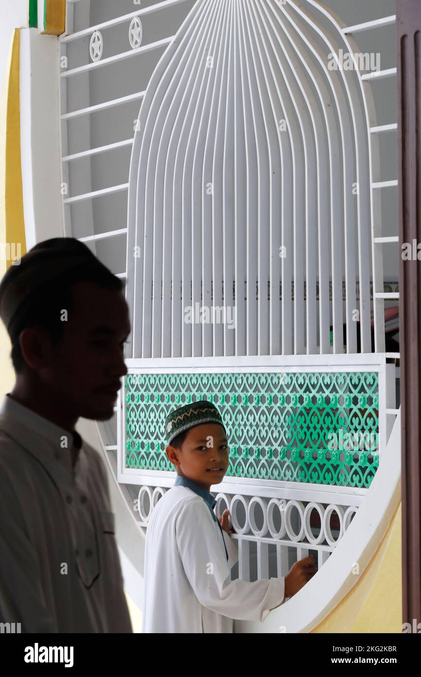 Cham community mosque.  Muslim boys wearing a kufi.   Chau Doc. Vietnam. Stock Photo