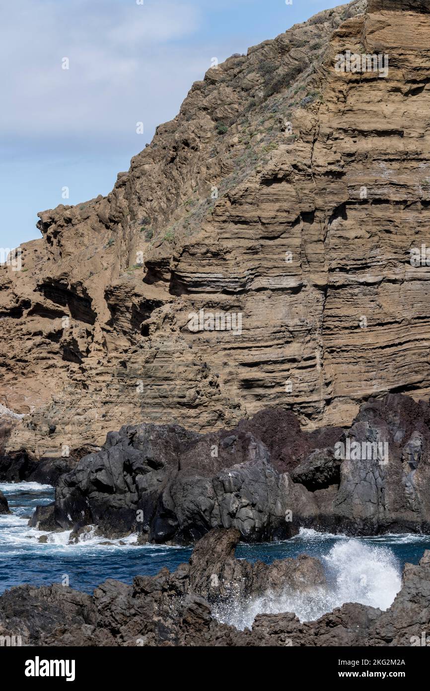 landscape of ocean shore at Madeira island with basalt and trachyte volcanic cliffs, shot in bright fall light at Porto Moniz, Portugal Stock Photo
