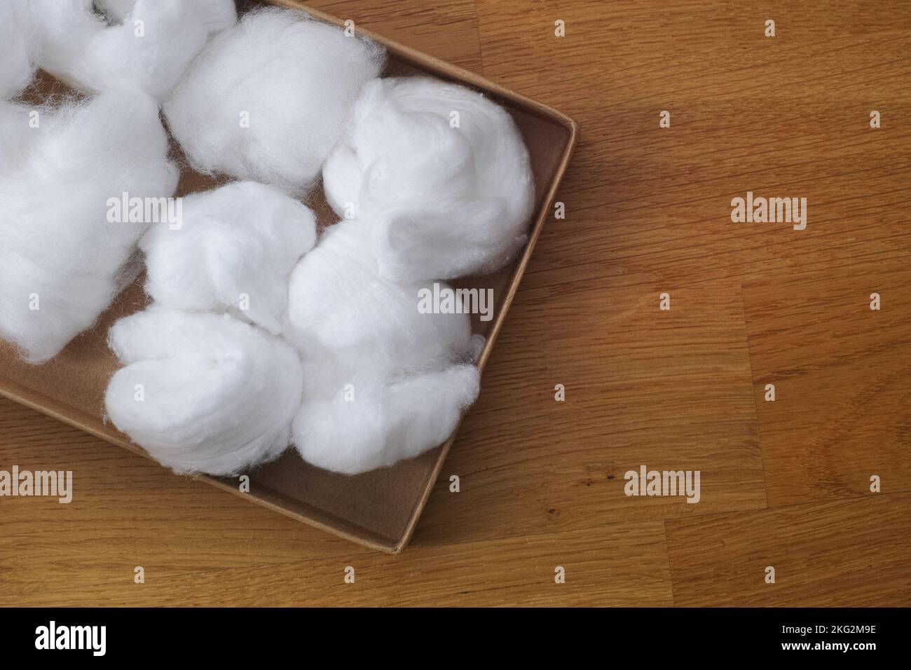 A cardboard box full of cotton balls. Close up Stock Photo - Alamy