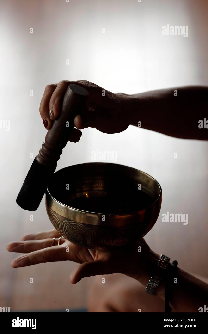 Singing bowl in hands prayer hires stock photography and images Alamy