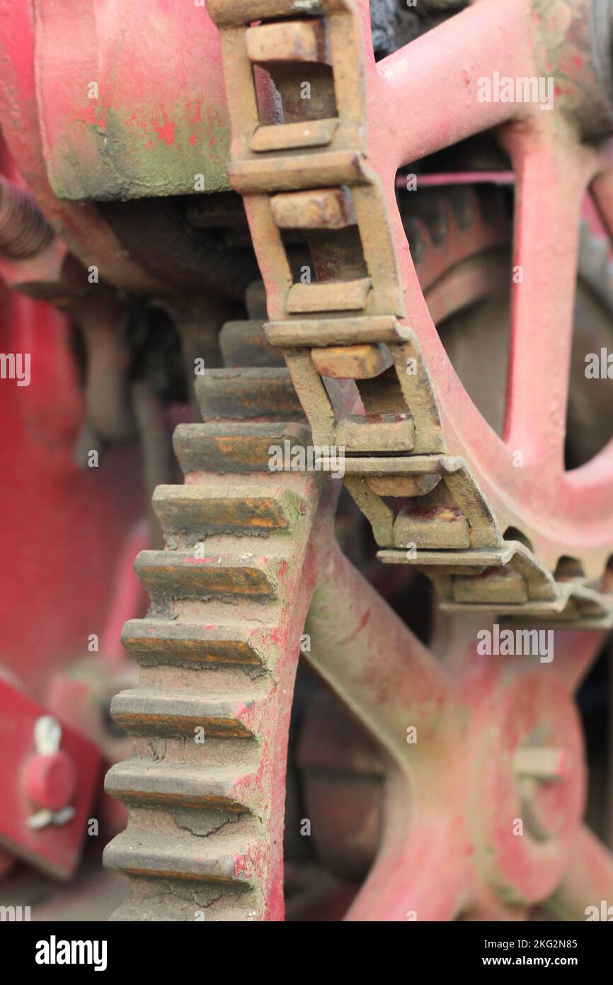 Vintage mechanical machine and engine with chains and gears in a black