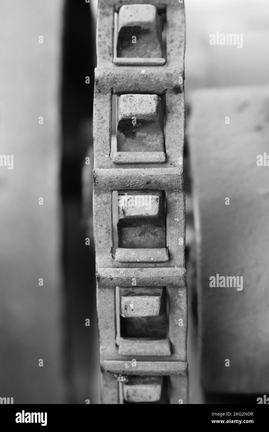 Vintage mechanical machine and engine with chains and gears in a black