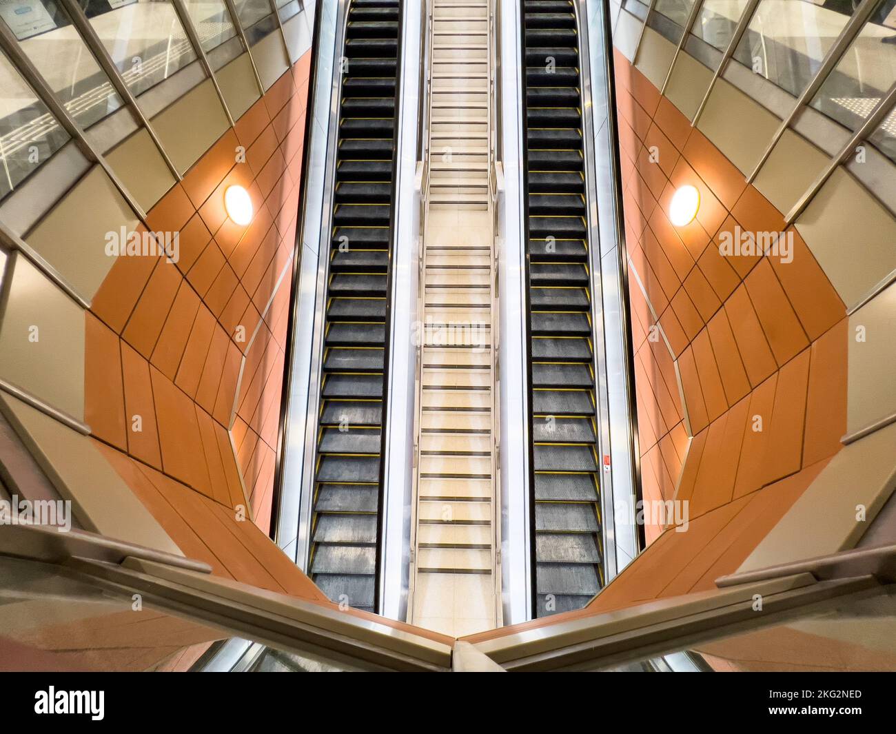 Long escalators in a symmetrical format. Stock Photo