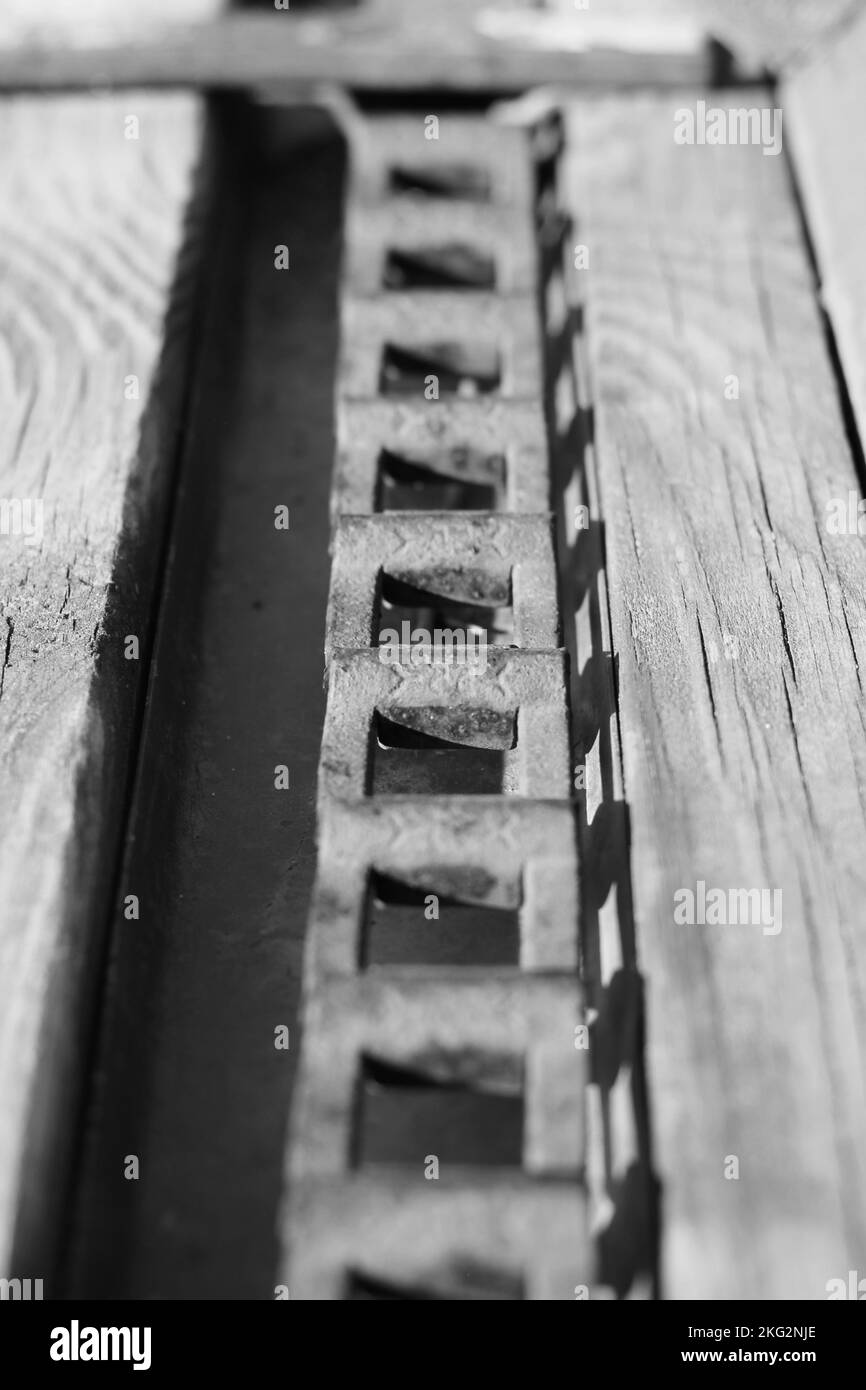 Vintage mechanical machine and engine with chains and gears in a black