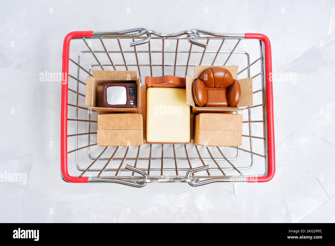 Selection of essential home furniture figurines and tiny delivery boxes