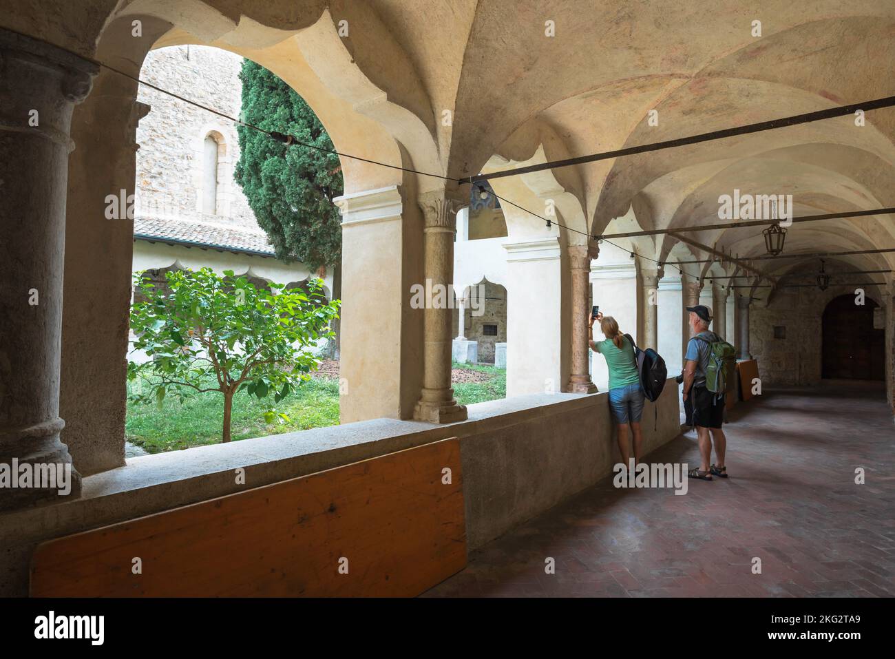 San Francesco Monastery Gargnano, view of people exploring the scenic cloisters of the San Francesco Monastery in Gargnano, Lake Garda, Italy Stock Photo