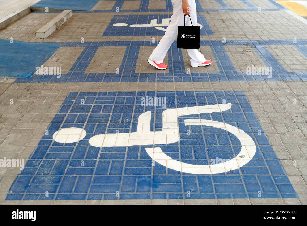 Handicapped disabled sign parking on road. Abu Dhabi. United Arab Emirates. Stock Photo