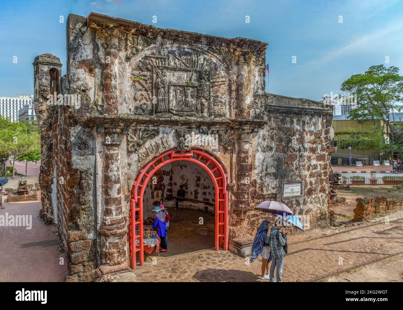Malacca City, Malaysia - February 28th 2018: Tourists at the Porta de Santiago gateway which is part of the A Famosa (The Famous) a Portuguese fortres Stock Photo