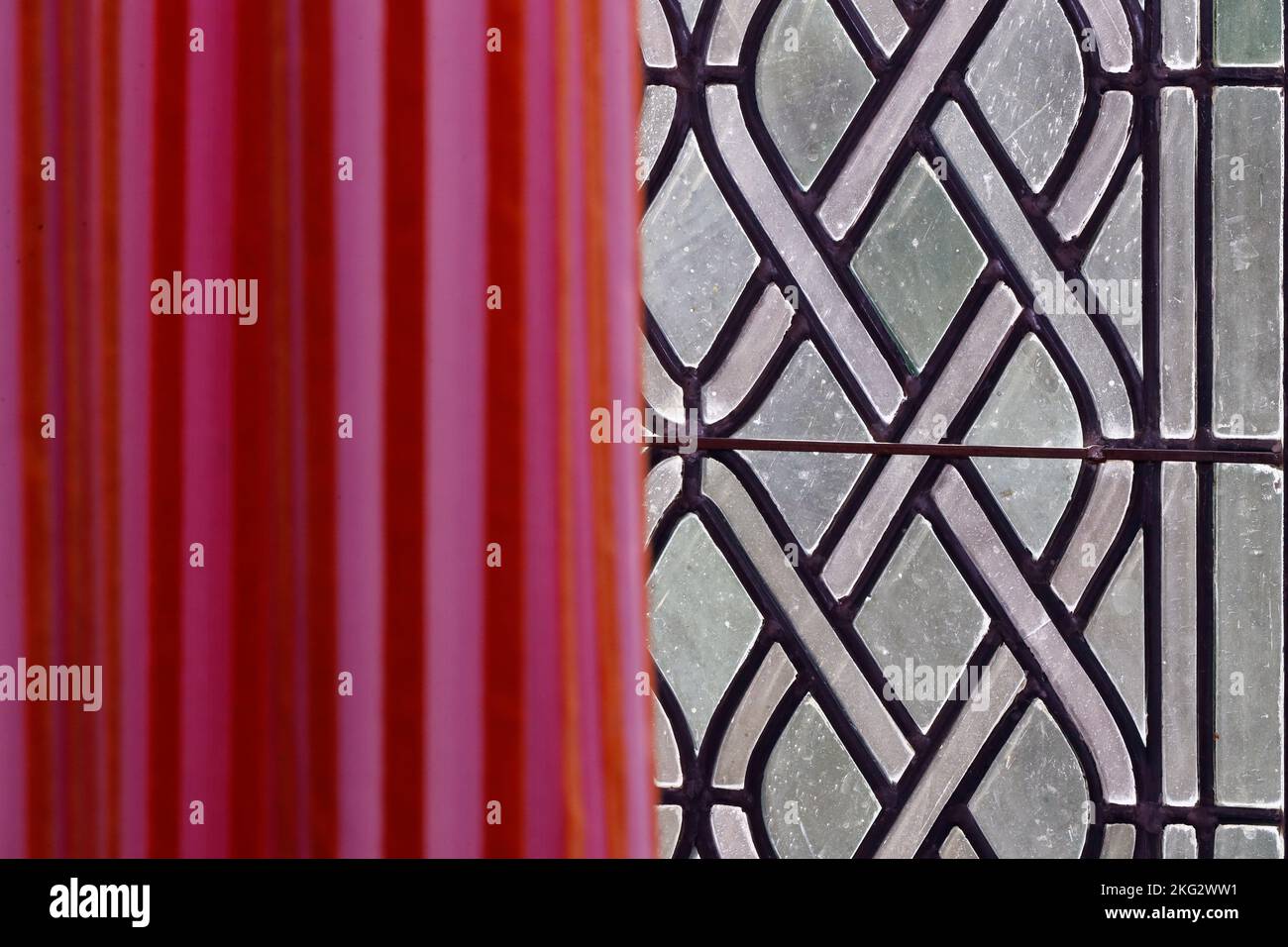 Old window with  red curtain in castle. Stock Photo