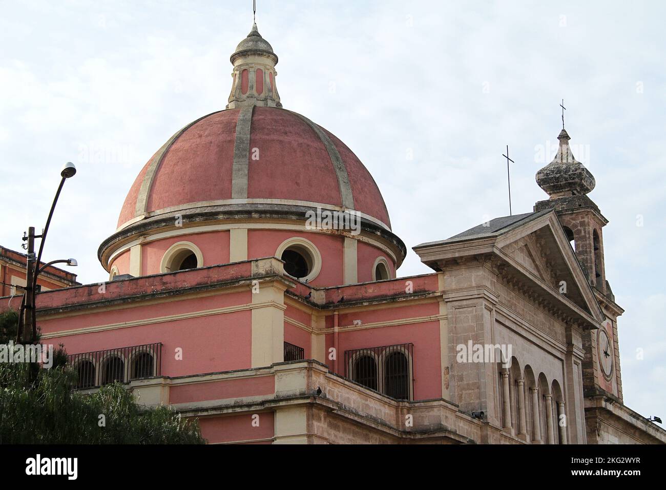 Fasano, Italy. Exterior view of Church of S. Anthony the Abbot, b. 16th- 18th century in Neoclassical style. The dome, bell/ clock tower & pediment. Stock Photo