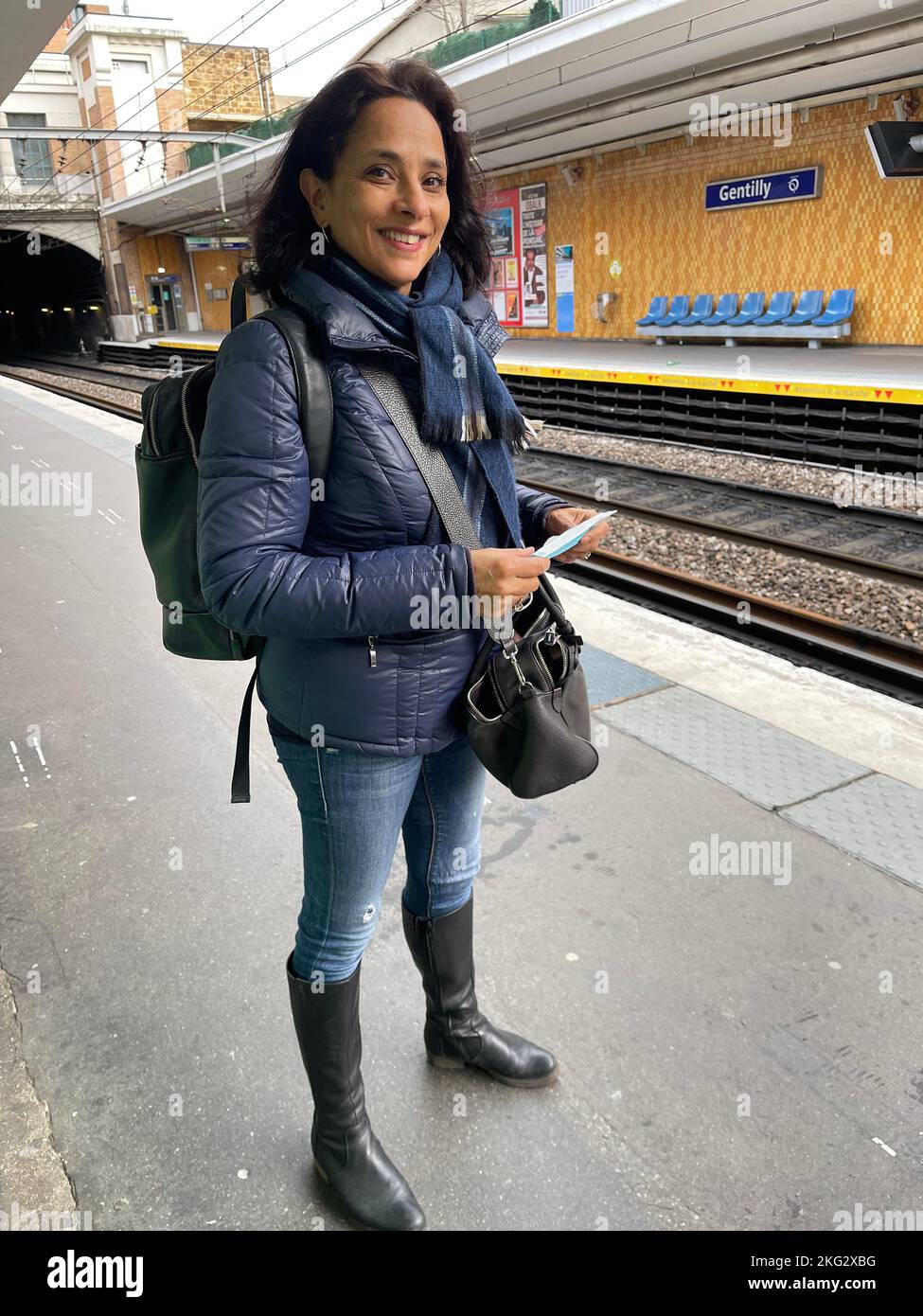 Woman waiting for the train hi-res stock photography and images - Alamy