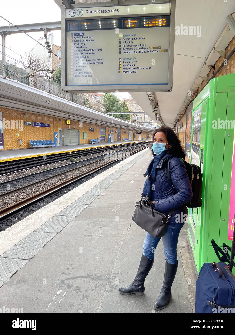 Woman waiting for the train hi-res stock photography and images - Alamy