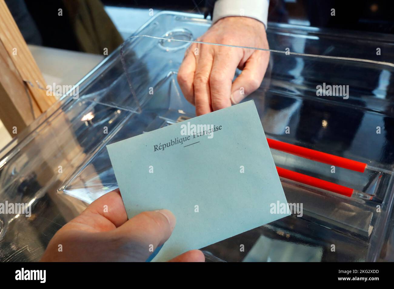 Election. Polling Booth. Man cast his ballot as he votes for the elections.  France. Stock Photo