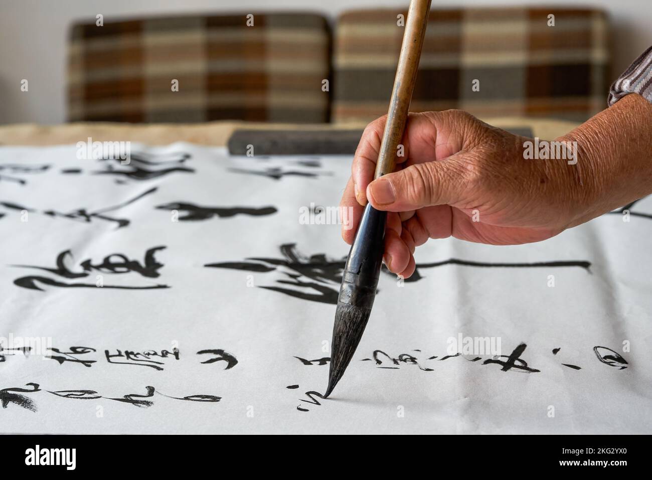An Old Chinese Calligrapher Is Writing Calligraphy Characters Creating Calligraphy Works Stock An Old Chinese Calligrapher Is Writing Calligraphy Characters Creating Calligraphy Works Stock