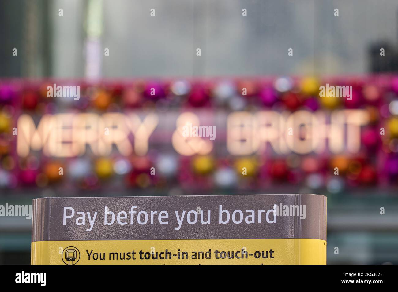 Christmas Lights on Manchester Arndale shopping centre with a timely warning on sign ( Tram payment sign) Uk is facing an economic crisis. Picture credit garyroberts/world Stock Photo