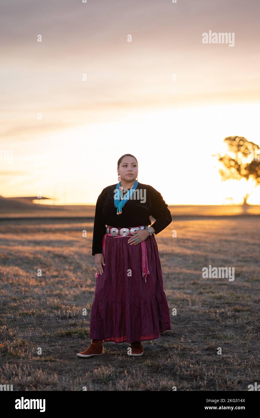 A Navajo Native American woman who was selling Indian bead necklaces along  the roadside poses for an informal portrait near Cameron, Arizona, USA,  part of the Navajo Nation of some 250,000 indigenous