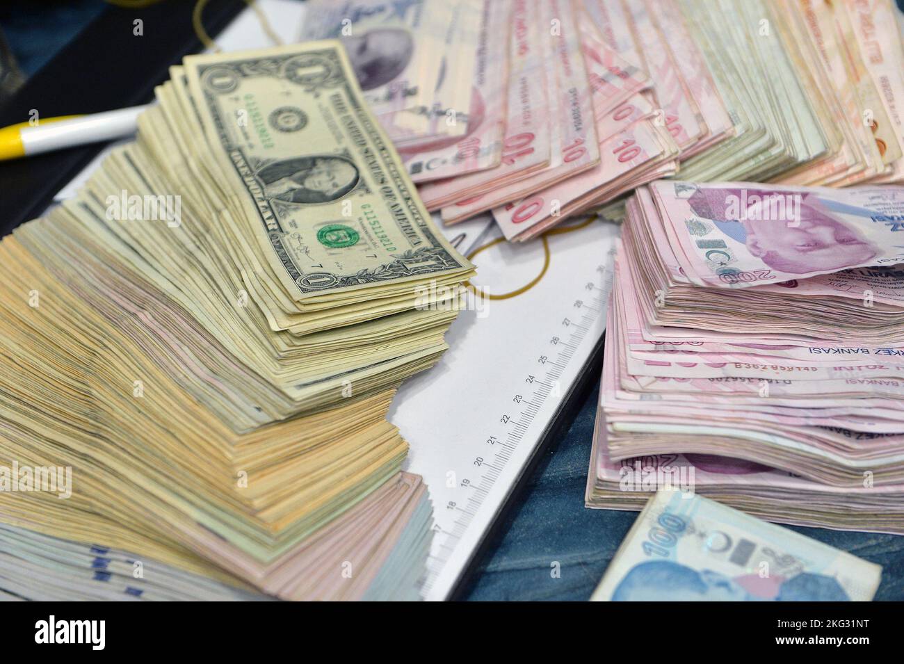 Turkish Lira and American Dollars. Financial crisis, devaluation and exchange rates themed banknotes close-up Stock Photo