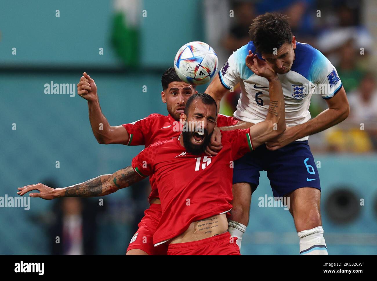 Doha, Qatar. 21st Nov, 2022. Harry Maguire of England beats Roozbeh Cheshmi of Iran and heads the ball to set up Bukayo Saka of England for the second goal during the FIFA World Cup match at Khalifa International Stadium, Doha. Picture credit should read: David Klein/Sportimage Credit: Sportimage/Alamy Live News Stock Photo