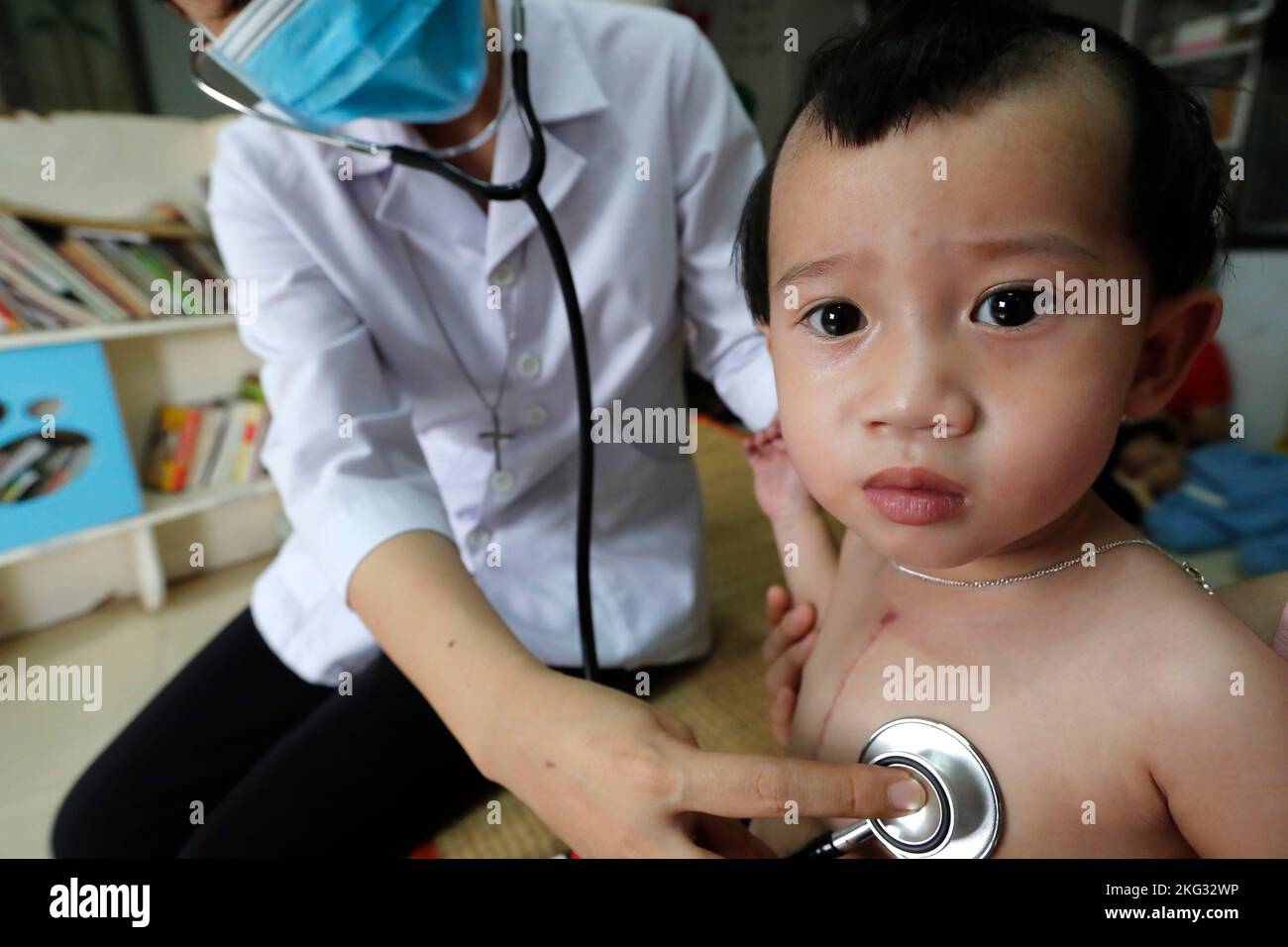 Children's pavilion run by Domincan catholic sisters and Chaine de l'Espoir. Child suffering of heart disease. Medical consultation.  Ho Chi Minh city Stock Photo