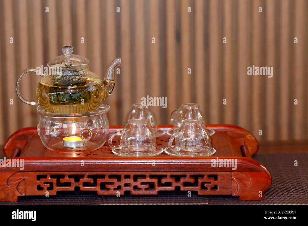 Glass teapot and cups for chinese tea ceremony in restaurant. Vietnam