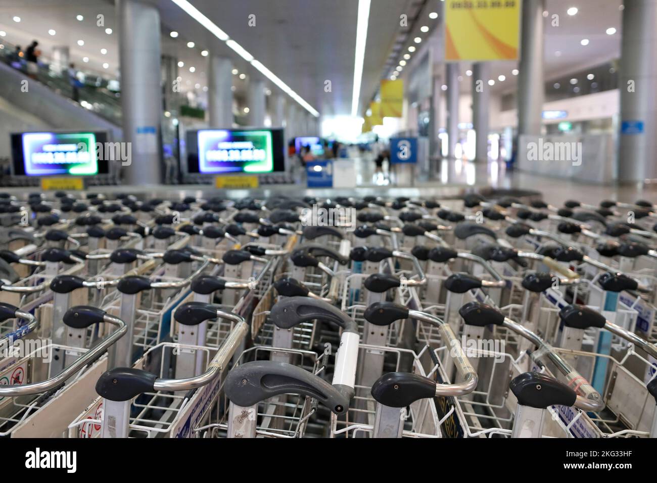 International airport. Baggage trolleys in arrivals area. Vietnam. Stock Photo