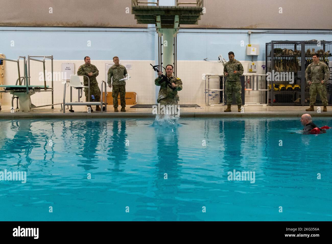 Staff Sgt. Keith Estes from Medical Department Activity, Camp Humphreys, South Korea, steps off the diving board during the Combat Water Survival Test in the 2022 Medical Readiness Command, Pacific Best Medic Competition Wednesday, October 26th 2022 at Joint Base Lewis-McChord. Stock Photo