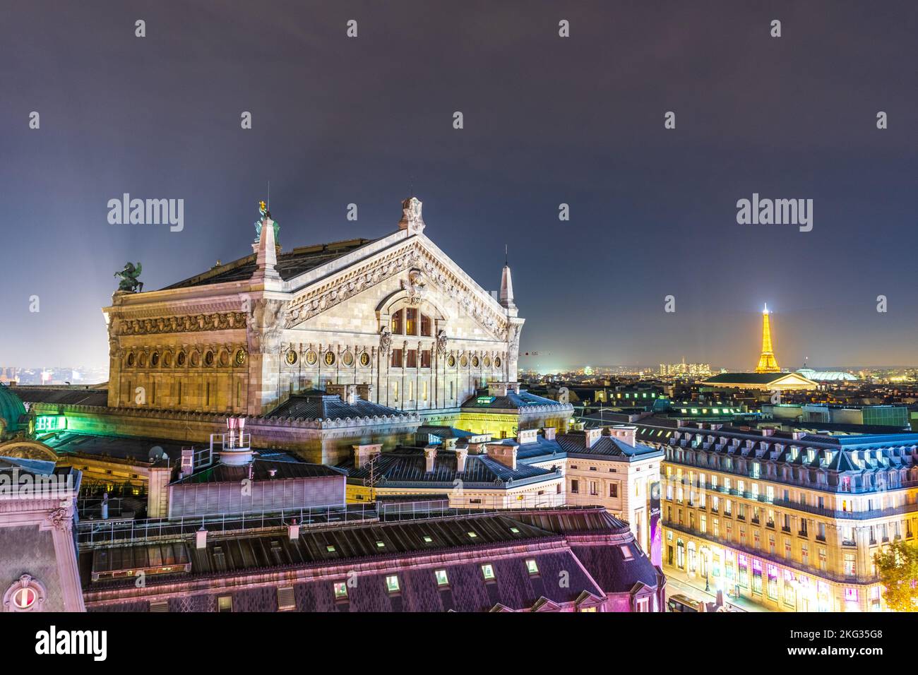 The Palais Garnier opera house and the Eiffel Tower at night in Paris ...