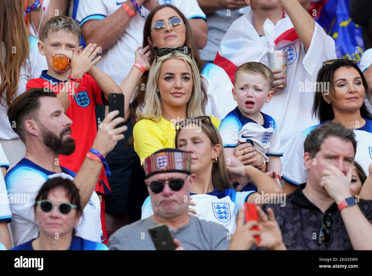 Megan Pickford, wife of England goalkeeper Jordan Pickford with their son Arlo George in the stands before the FIFA World Cup Group B match at the Khalifa International Stadium in Doha, Qatar. Picture date: Monday November 21, 2022. Stock Photo