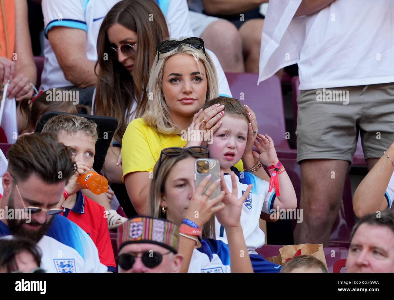 Megan Pickford, wife of England goalkeeper Jordan Pickford with their son Arlo George in the stands before the FIFA World Cup Group B match at the Khalifa International Stadium in Doha, Qatar. Picture date: Monday November 21, 2022. Stock Photo