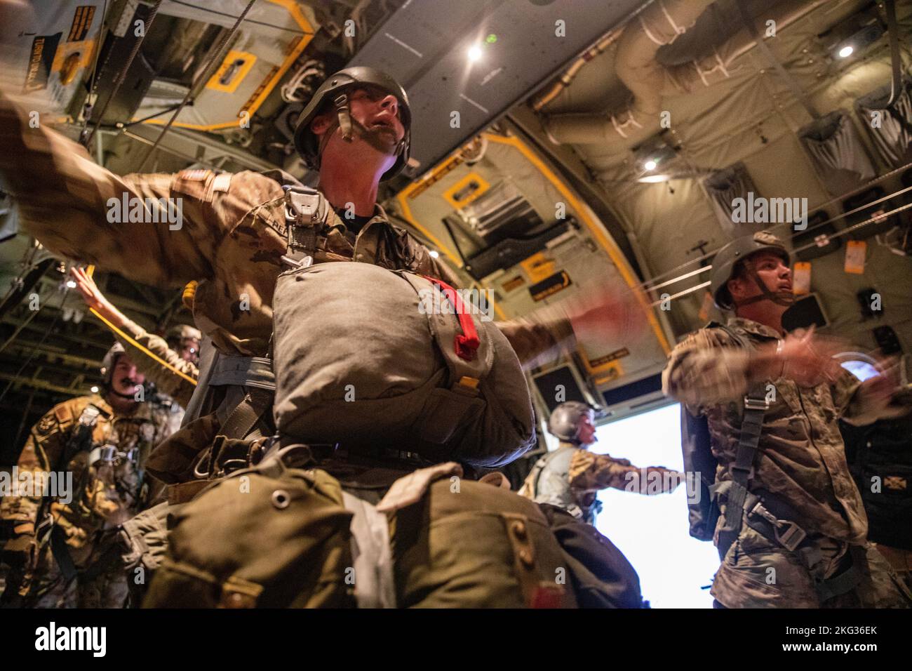 7th Special Forces Group (Airborne) jumpmasters issue commands inside a C130 Hercules over Son