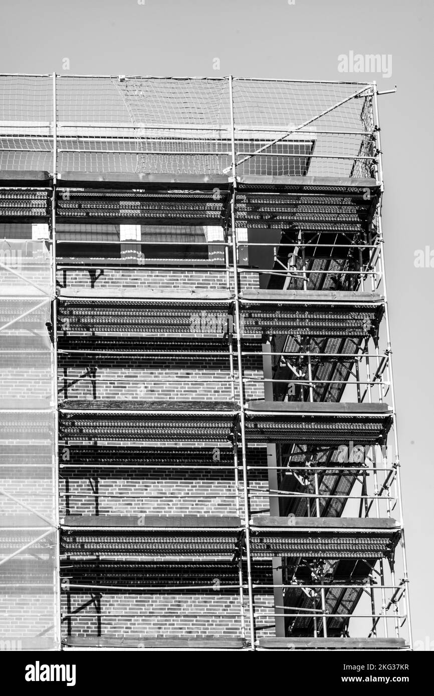 The vertical grayscale low-angle shot of a construction site Stock ...