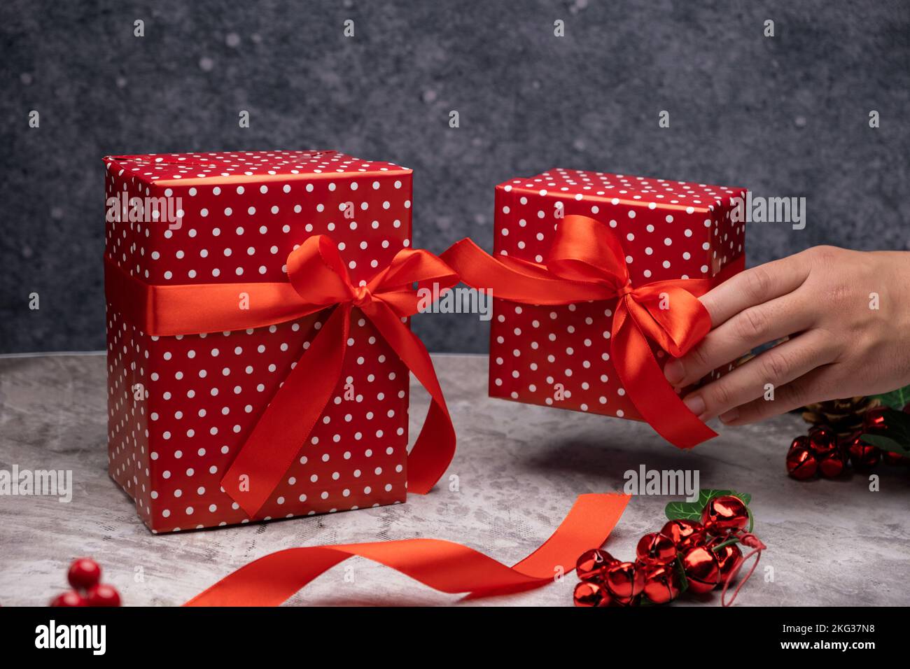 Hand holding Christmas gifts, Christmas concept Stock Photo