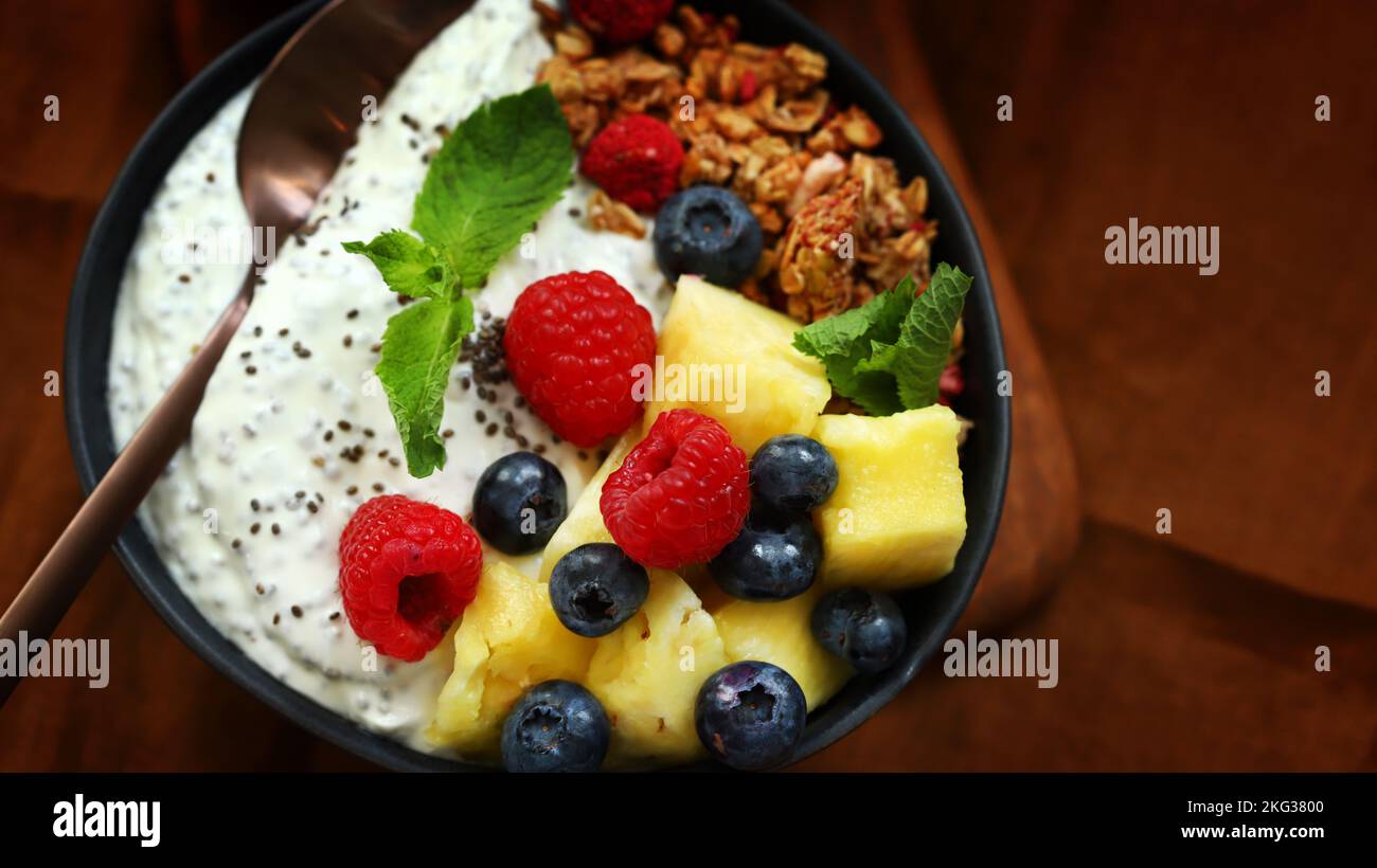 Breakfast bowl with chia yogurt, berries and fruits. Healthy snack or dessert. Stock Photo